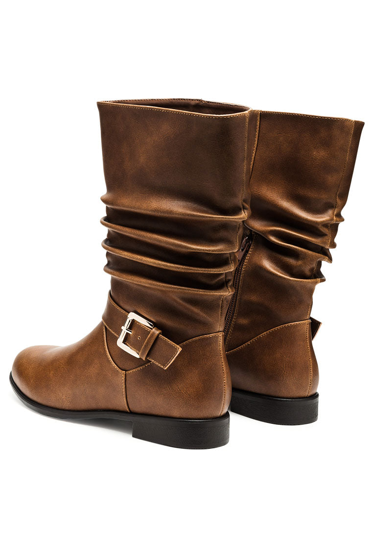 Folds Slouch Faux Leather Ankle Boots with buckle belt embellishment and side zipper, showcasing a stylish slouch design.