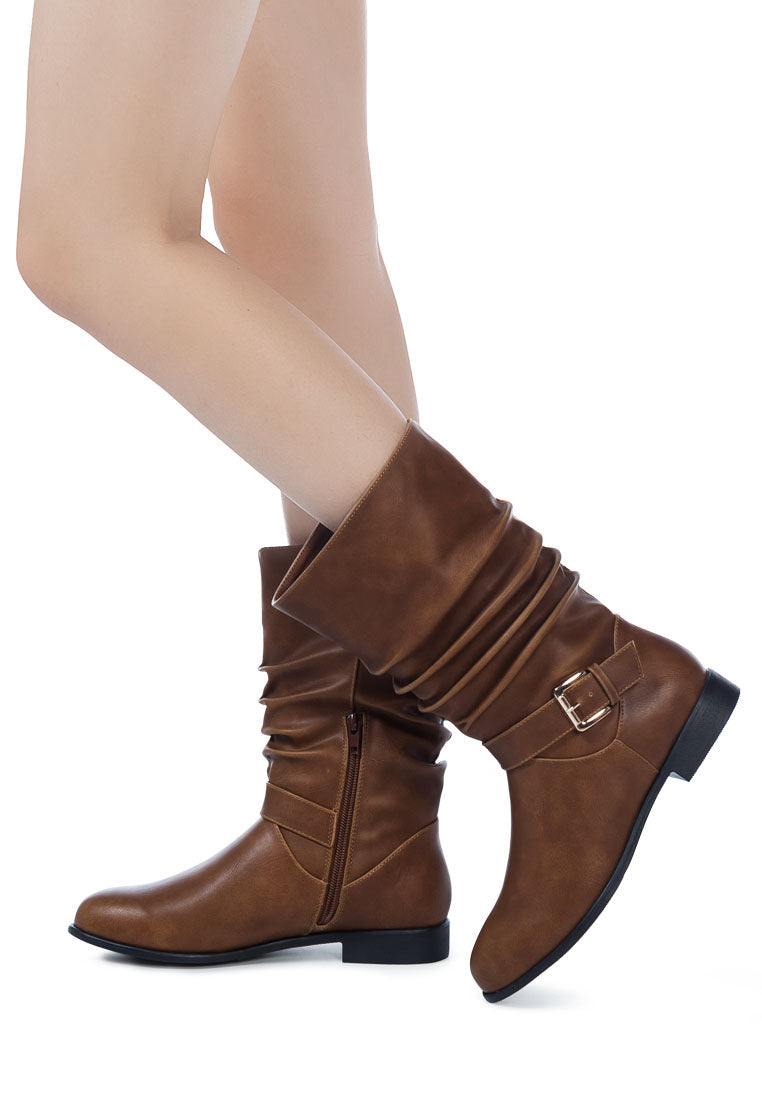 Folds Slouch Faux Leather Ankle Boots with buckle belt embellishment and side zipper, showcasing a stylish slouch design.