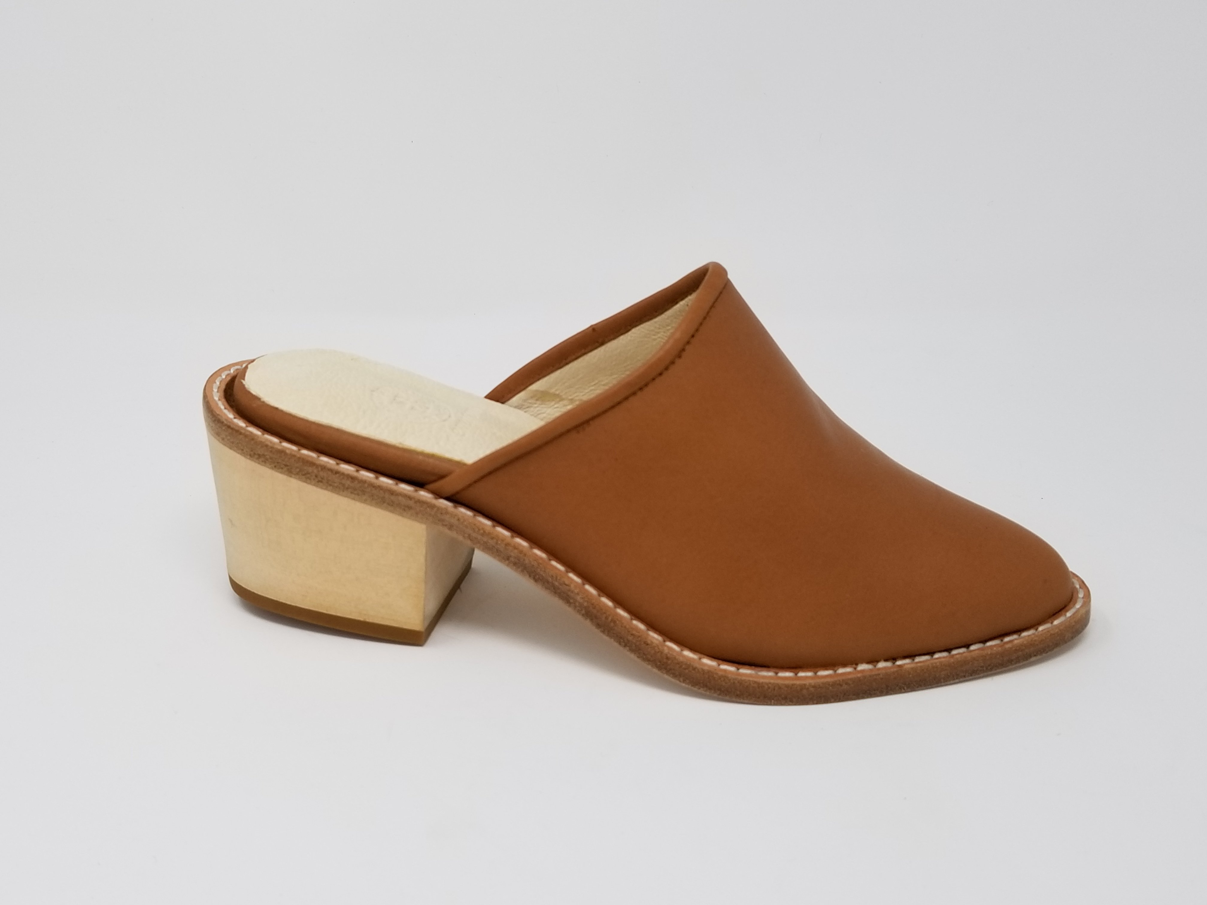 A pair of elegant Foxhill shoes featuring a full leather upper, memory foam insole, and stylish wood heel, perfect for any occasion.