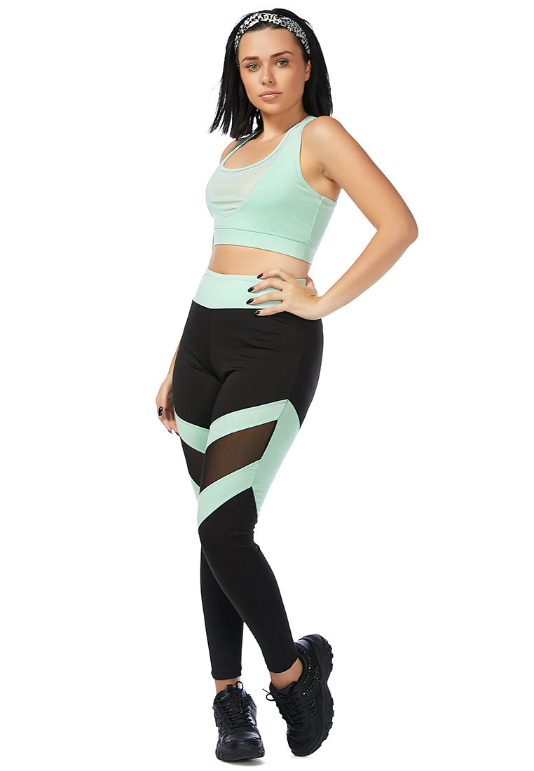 Geometric Paneled Mesh Yoga Leggings in black with white side seams, showcasing a high-rise fit and broad elastic waistband.