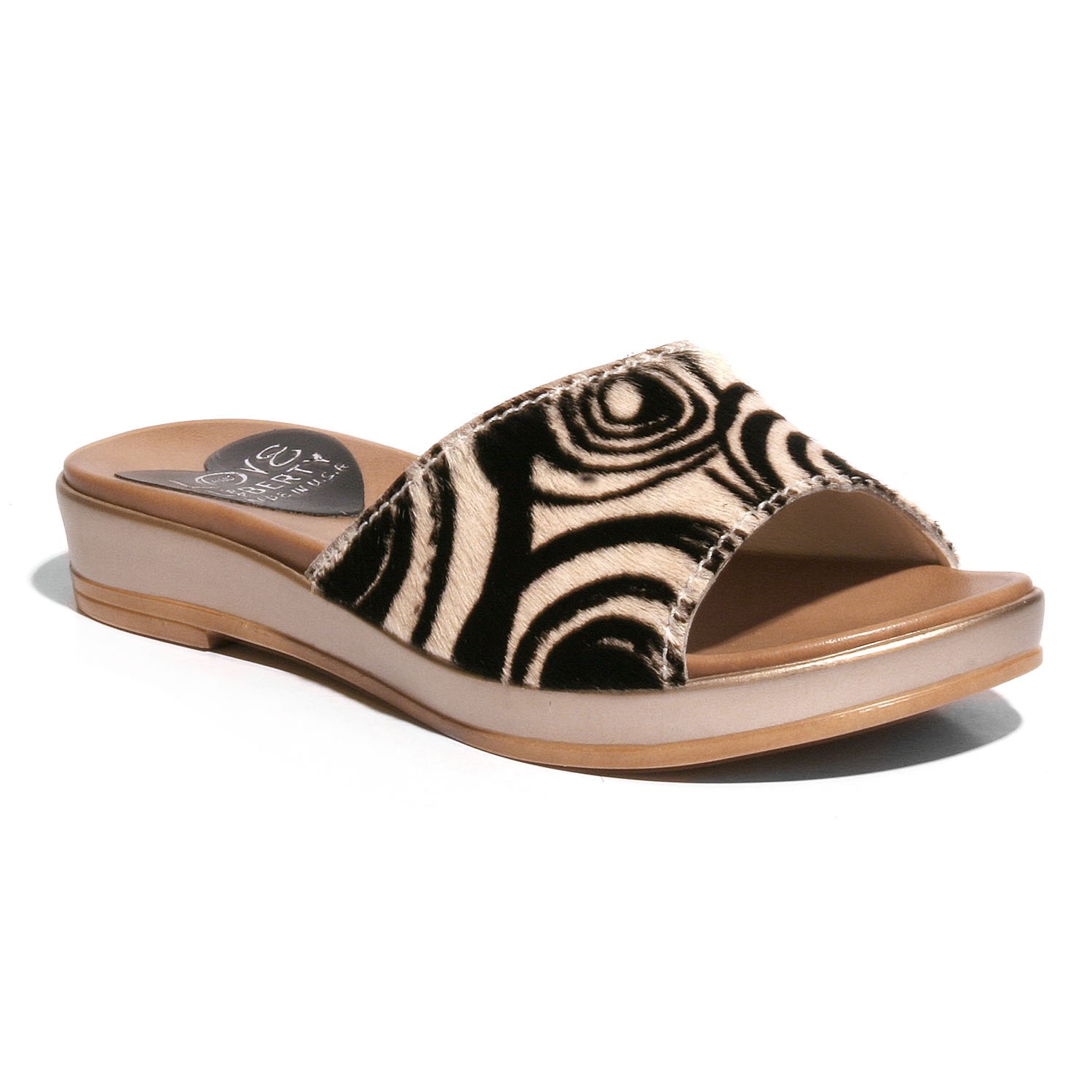 Stylish Getaway sandal with crinkled leather upper and low wedge outsole, perfect for any occasion.