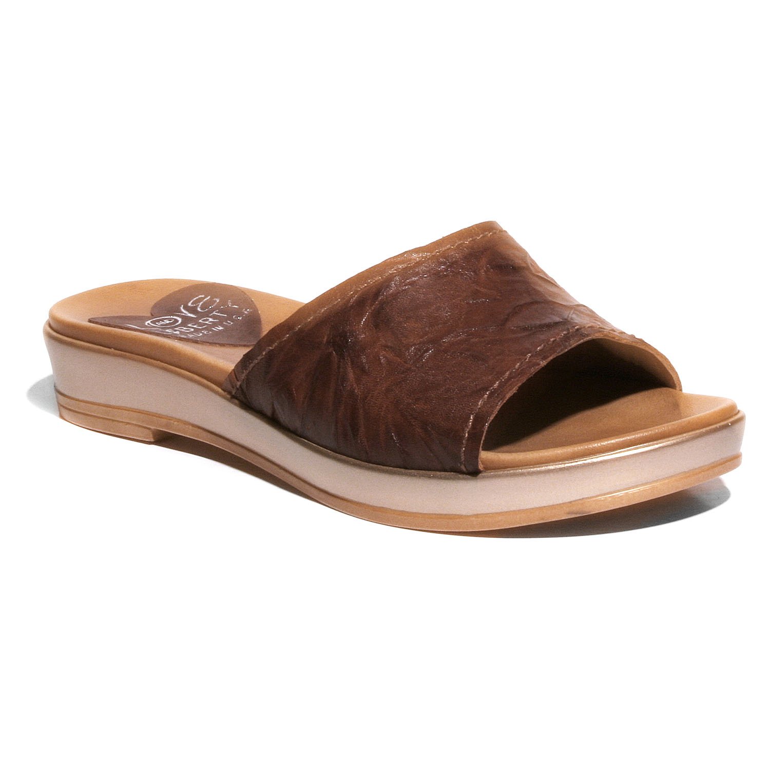 Stylish Getaway sandal with crinkled leather upper and low wedge outsole, perfect for any occasion.