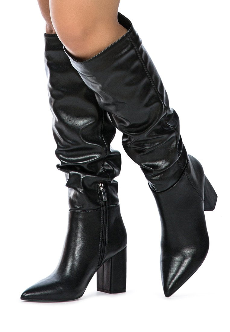 Hanoi Knee High Slouch Boots featuring a shiny finish, side zipper, and block heel design.