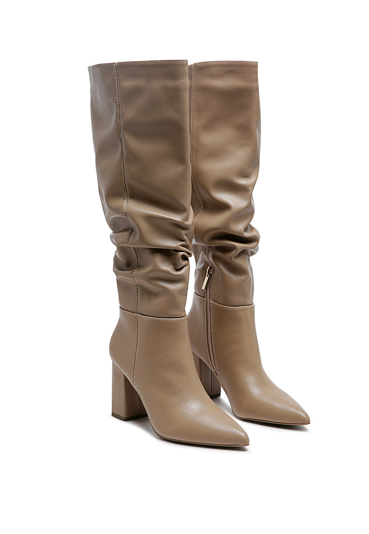 Hanoi Knee High Slouch Boots featuring a shiny finish, side zipper, and block heel design.