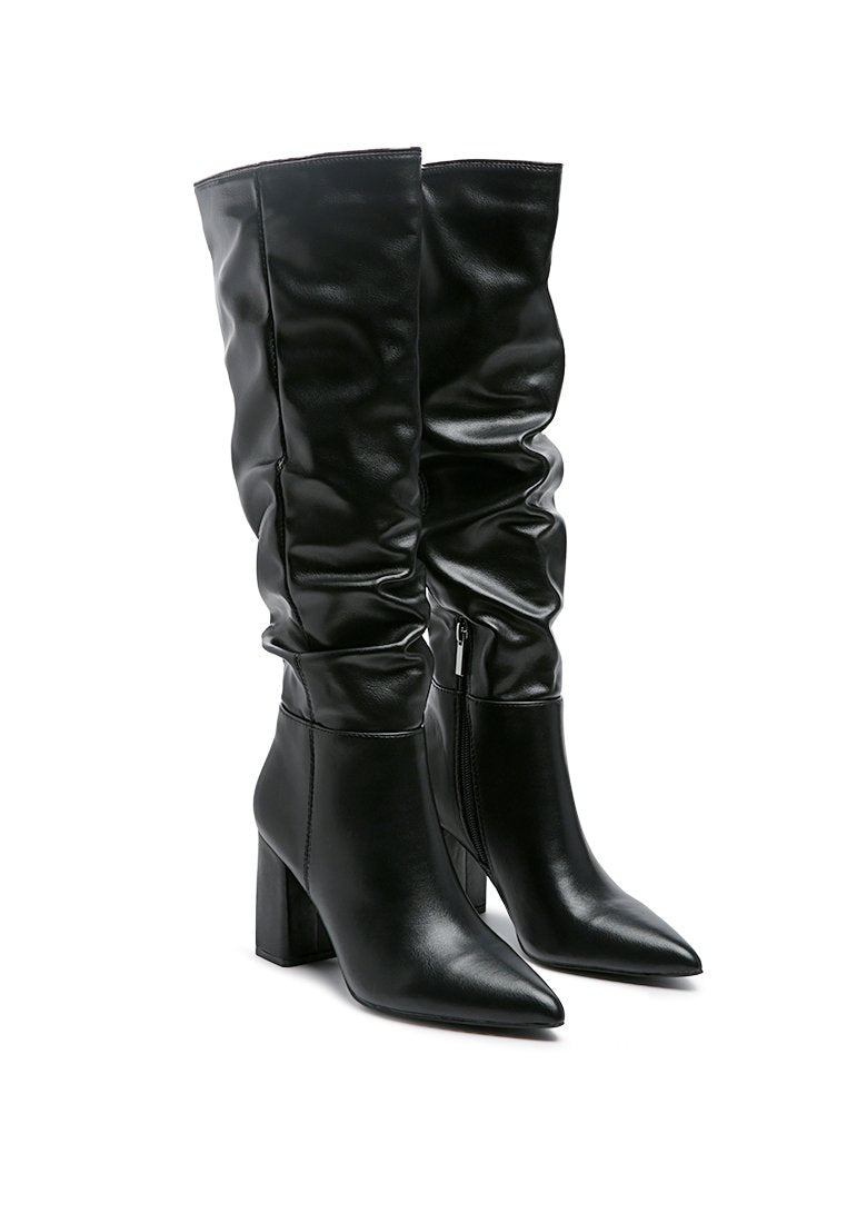 Hanoi Knee High Slouch Boots featuring a shiny finish, side zipper, and block heel design.