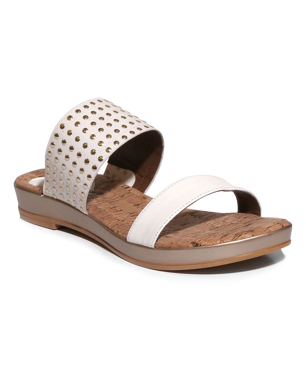 Stylish Havana sandals with leather upper and studs, featuring a cork sock liner and low wedge outsole, perfect for summer vacations.