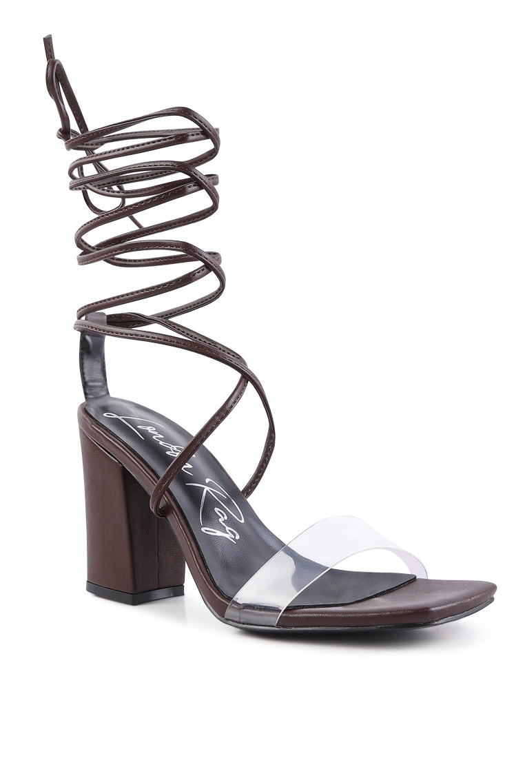 High Cult Strappy Tie-Up Block Heels featuring clear straps, block heel, and open square toe design.