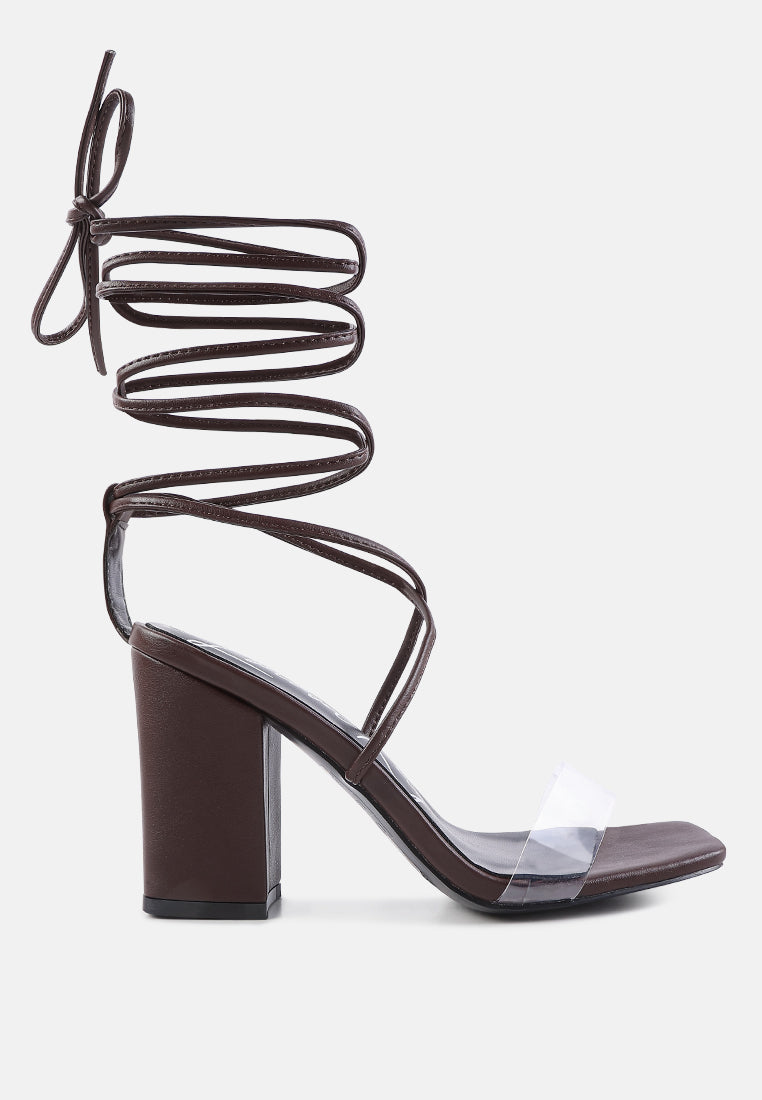 High Cult Strappy Tie-Up Block Heels featuring clear straps, block heel, and open square toe design.