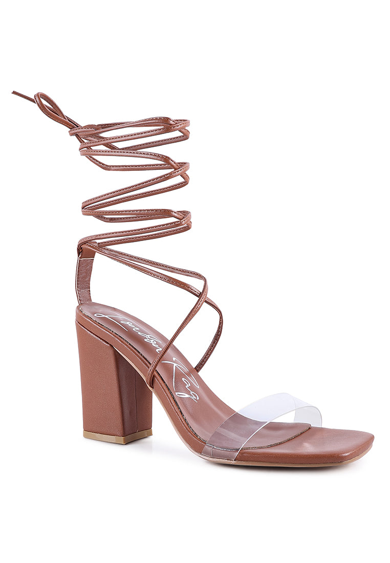 High Cult Strappy Tie-Up Block Heels featuring clear straps, block heel, and open square toe design.