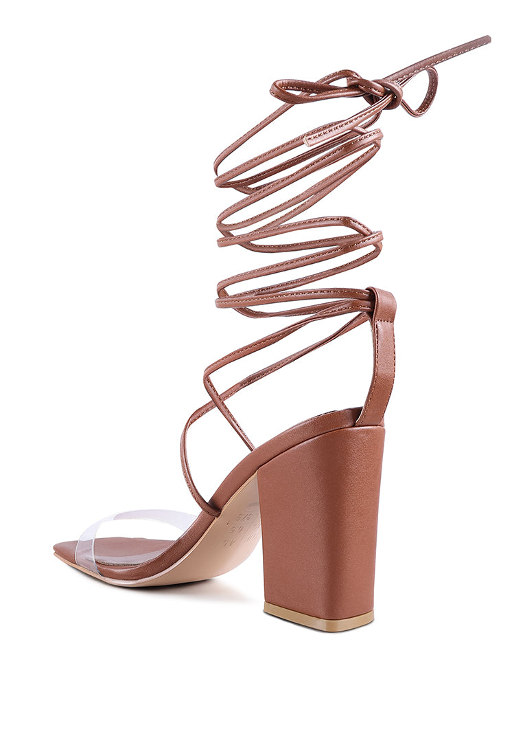 High Cult Strappy Tie-Up Block Heels featuring clear straps, block heel, and open square toe design.