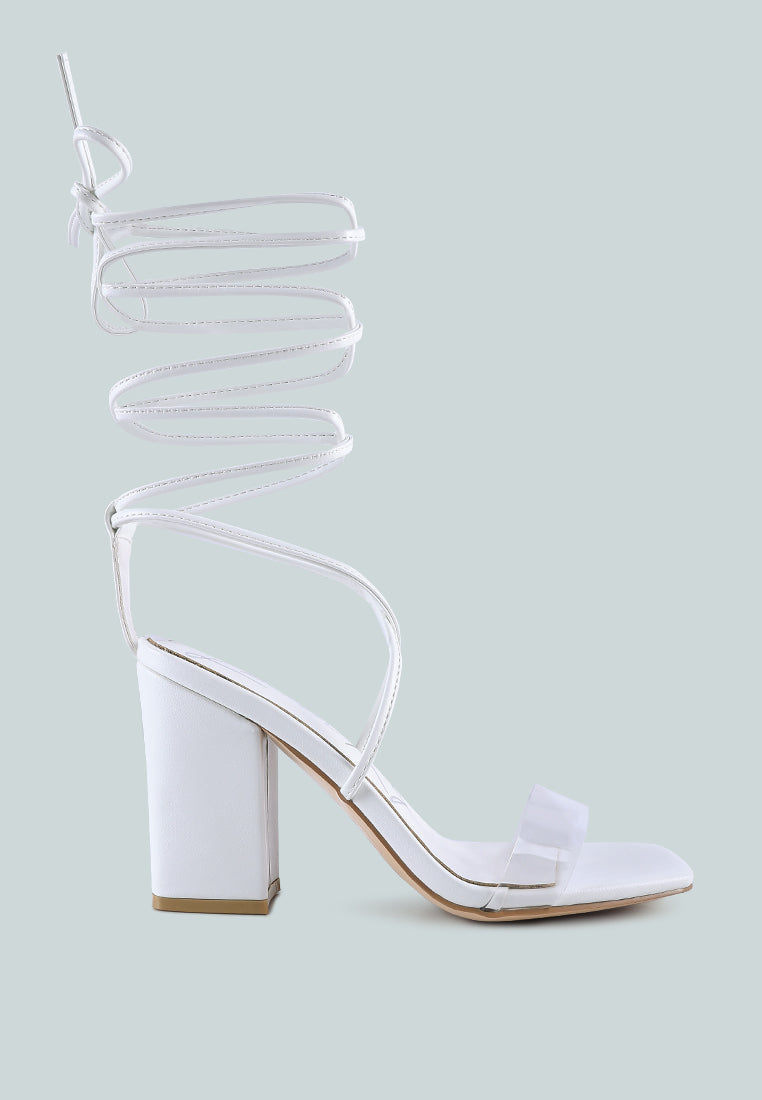 High Cult Strappy Tie-Up Block Heels featuring clear straps, block heel, and open square toe design.