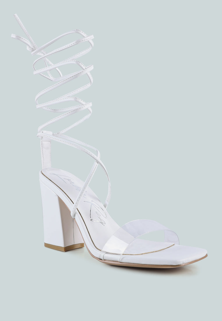 High Cult Strappy Tie-Up Block Heels featuring clear straps, block heel, and open square toe design.