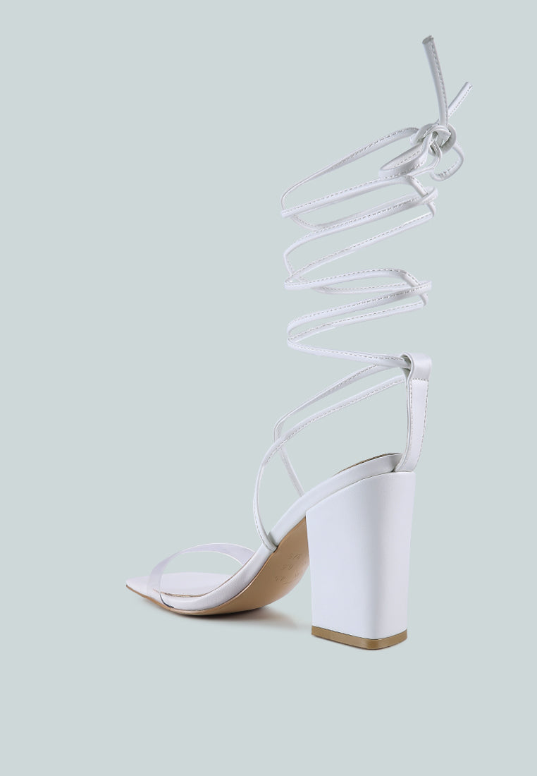 High Cult Strappy Tie-Up Block Heels featuring clear straps, block heel, and open square toe design.