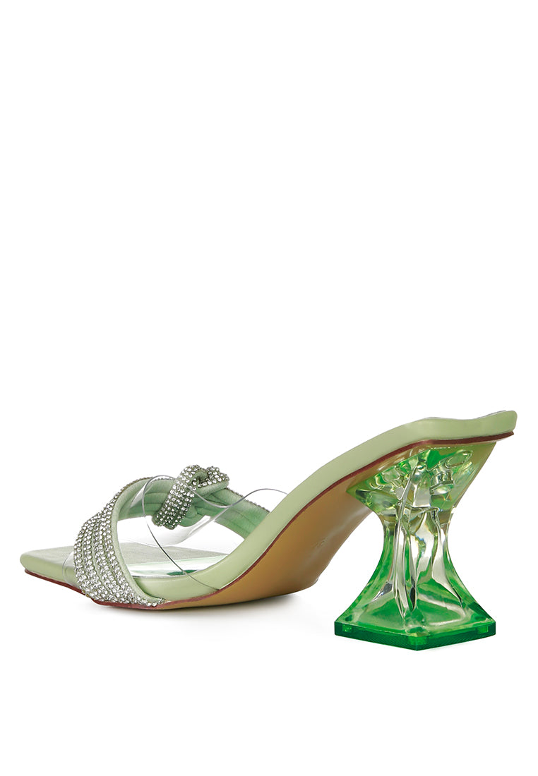 Hiorda Rhinestone Knotted Spool Heel Sandals featuring clear faux leather, rhinestone embellishments, and a stylish spool heel.