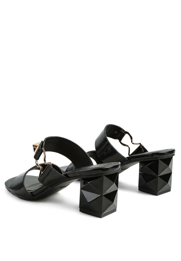 Elegant Hookup Fantasy Block Heel Sandals featuring a rock-cut design, metallic buckle, and open square toe.