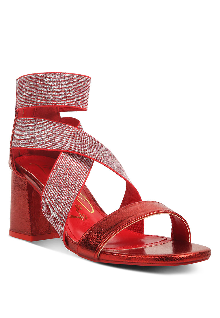 Huskies Metallic Faux Leather Block Heel Sandals featuring elastic straps and a stylish design.