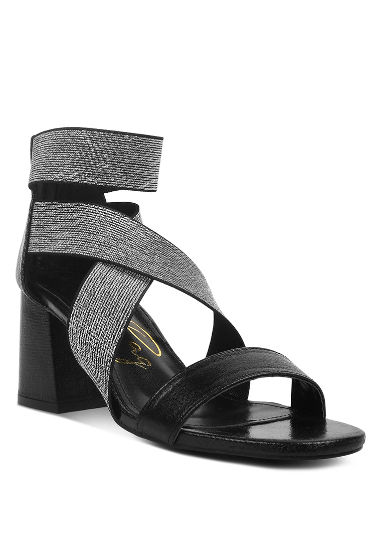 Huskies Metallic Faux Leather Block Heel Sandals featuring elastic straps and a stylish design.