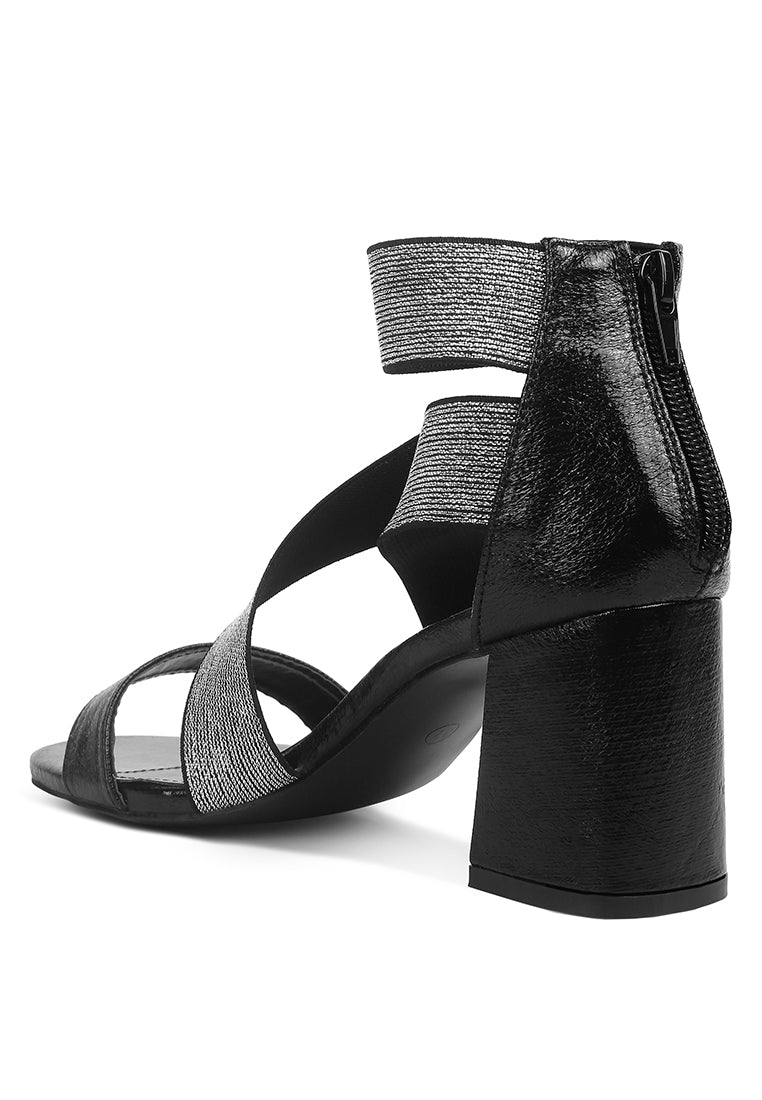 Huskies Metallic Faux Leather Block Heel Sandals featuring elastic straps and a stylish design.