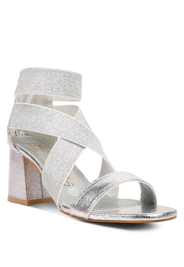 Huskies Metallic Faux Leather Block Heel Sandals featuring elastic straps and a stylish design.