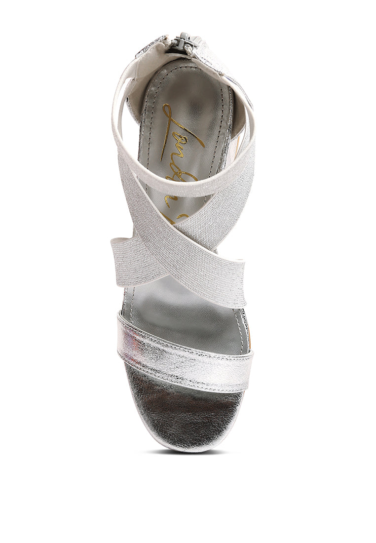 Huskies Metallic Faux Leather Block Heel Sandals featuring elastic straps and a stylish design.