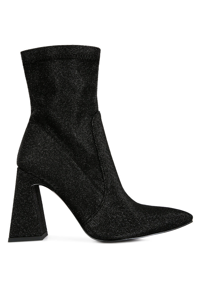 Hustlers Shimmer Block Heeled Ankle Boots featuring a shiny textile, block heels, and a side zipper for easy wear.