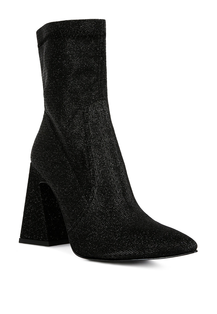 Hustlers Shimmer Block Heeled Ankle Boots featuring a shiny textile, block heels, and a side zipper for easy wear.