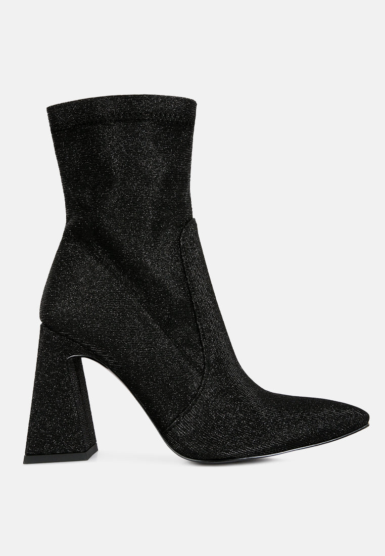 Hustlers Shimmer Block Heeled Ankle Boots featuring a shiny textile, block heels, and a side zipper for easy wear.