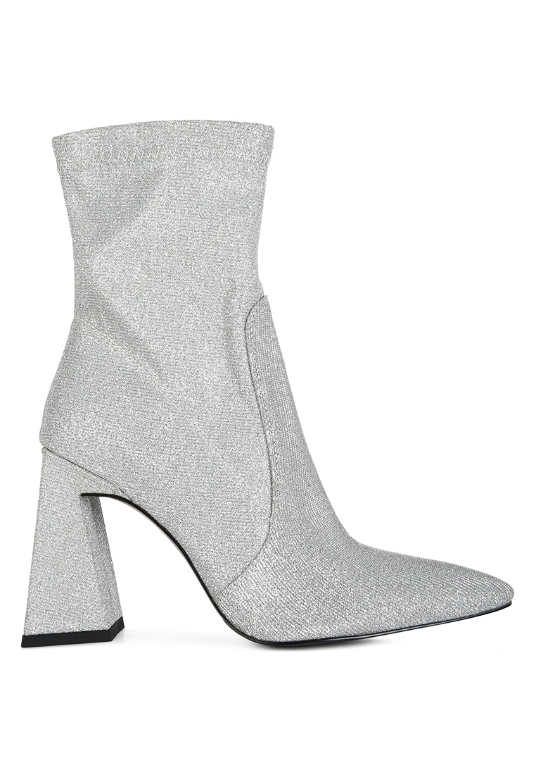 Hustlers Shimmer Block Heeled Ankle Boots featuring a shiny textile, block heels, and a side zipper for easy wear.