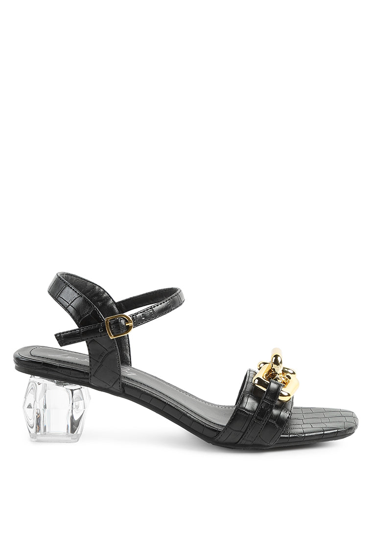 Icicle Clear Low Heel Metal Chain Sandals featuring shiny metal trims and croc textured upper.