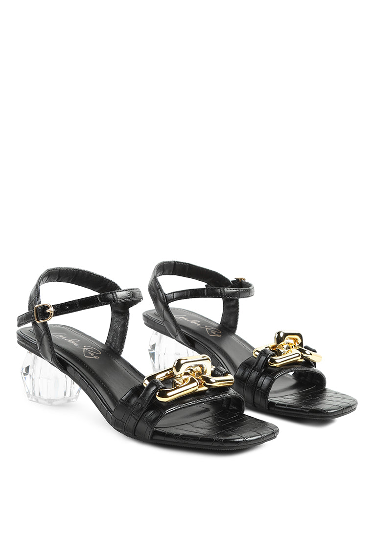 Icicle Clear Low Heel Metal Chain Sandals featuring shiny metal trims and croc textured upper.