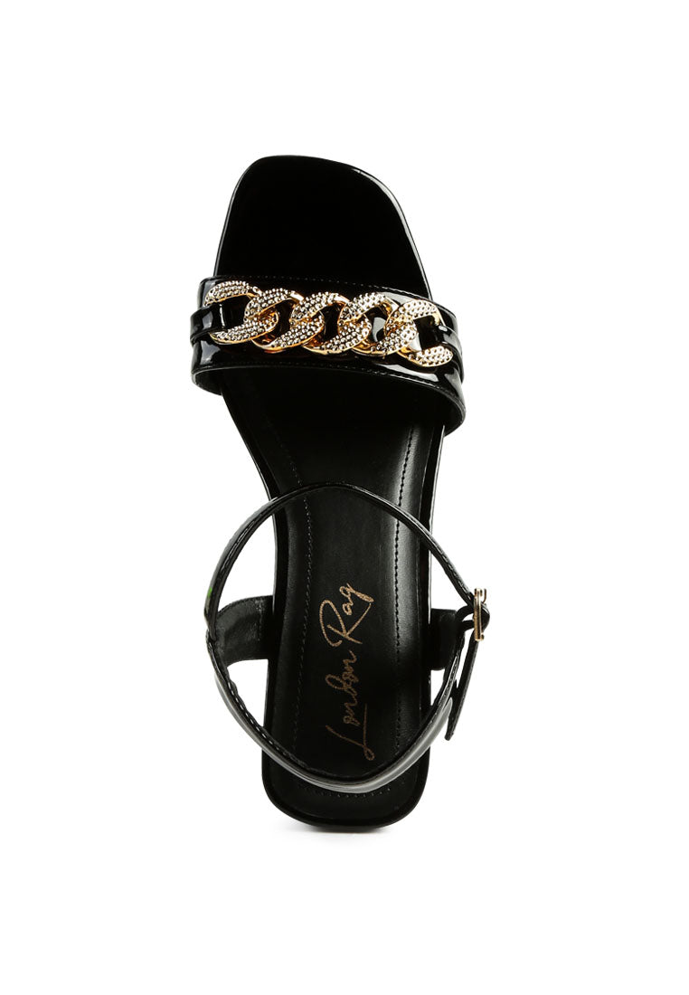 Illusion Metal Chain Link Fantasy Heel Sandals featuring a rock cut design, metallic gold chain, and comfortable mid heel.