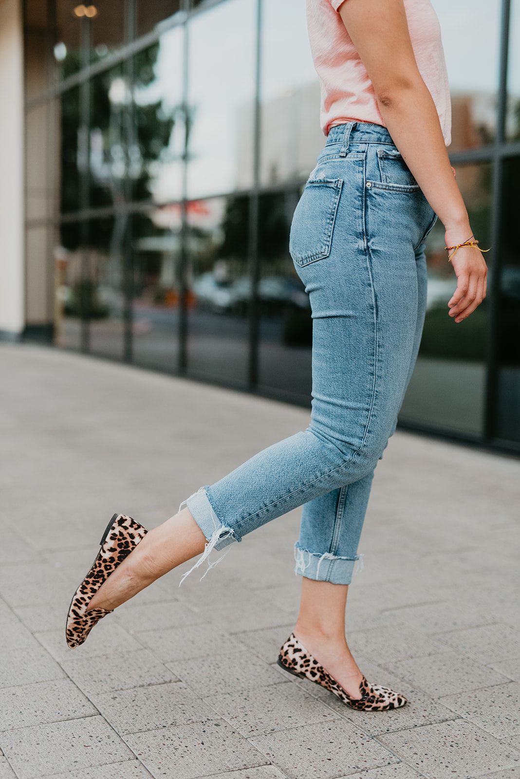 A pair of stylish pointed leopard print flats with a high heel carry bag, showcasing their elegant design and comfort features.