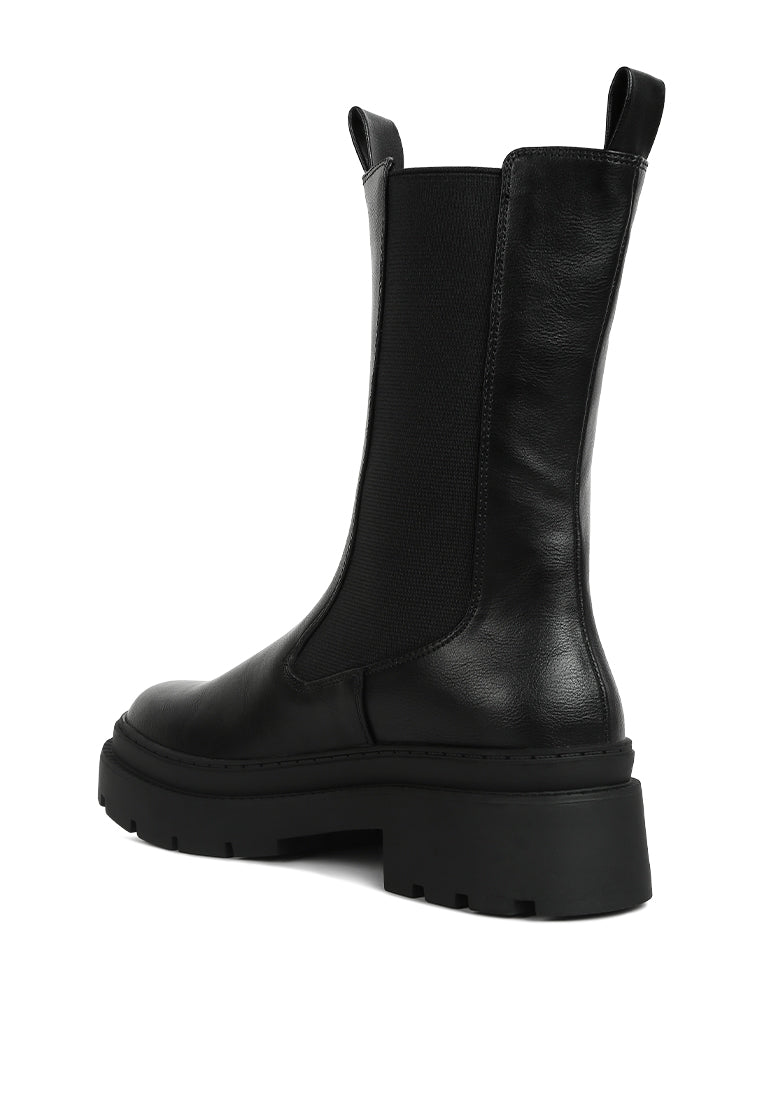 Stylish Jolt Elasticated Gussets Lug Sole Boots featuring faux leather upper and rubber lug sole, perfect for women seeking comfort and fashion.