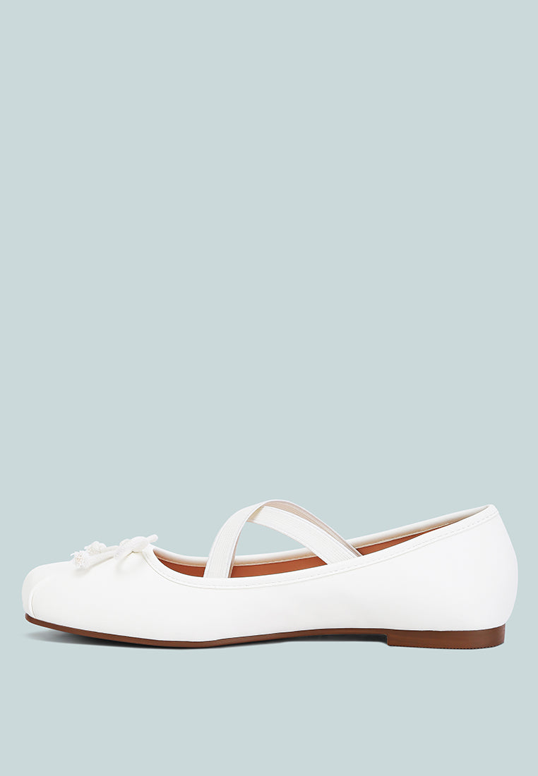 Leina Recycled Faux Leather Ballet Flats featuring criss-cross straps and bow embellishment, perfect for stylish comfort.