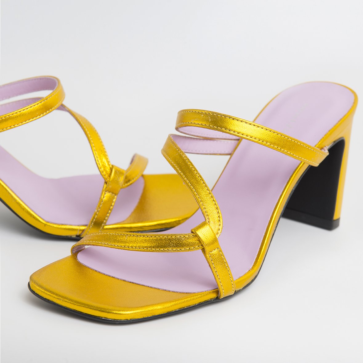 LILY Gold shoes featuring metallic leather upper, thin straps, and square cut toes, handcrafted in Portugal.