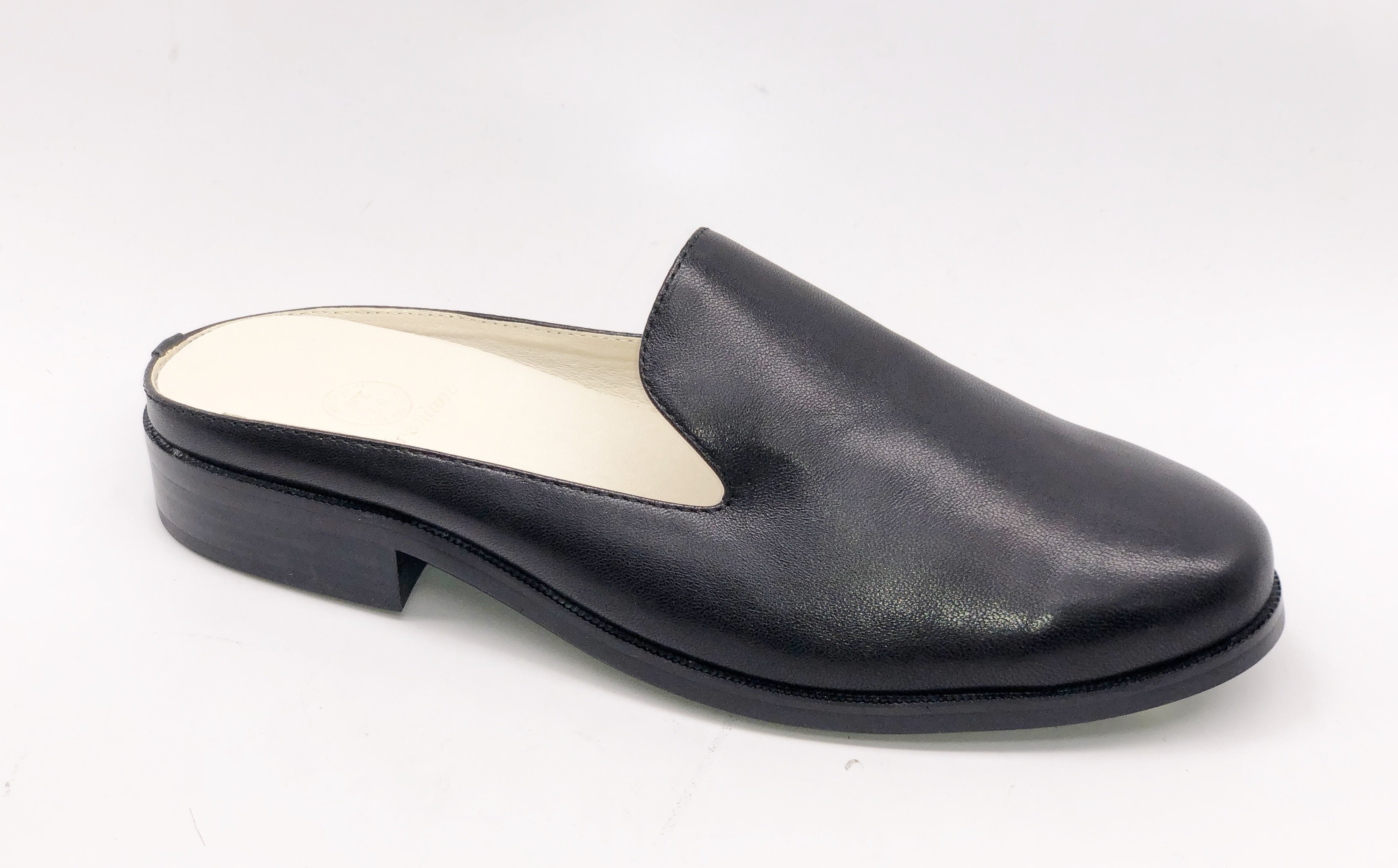 A pair of Long Beach shoes made from premium leather, featuring a sleek design with a full foam insole and slip-resistant outsole, perfect for comfort and style.