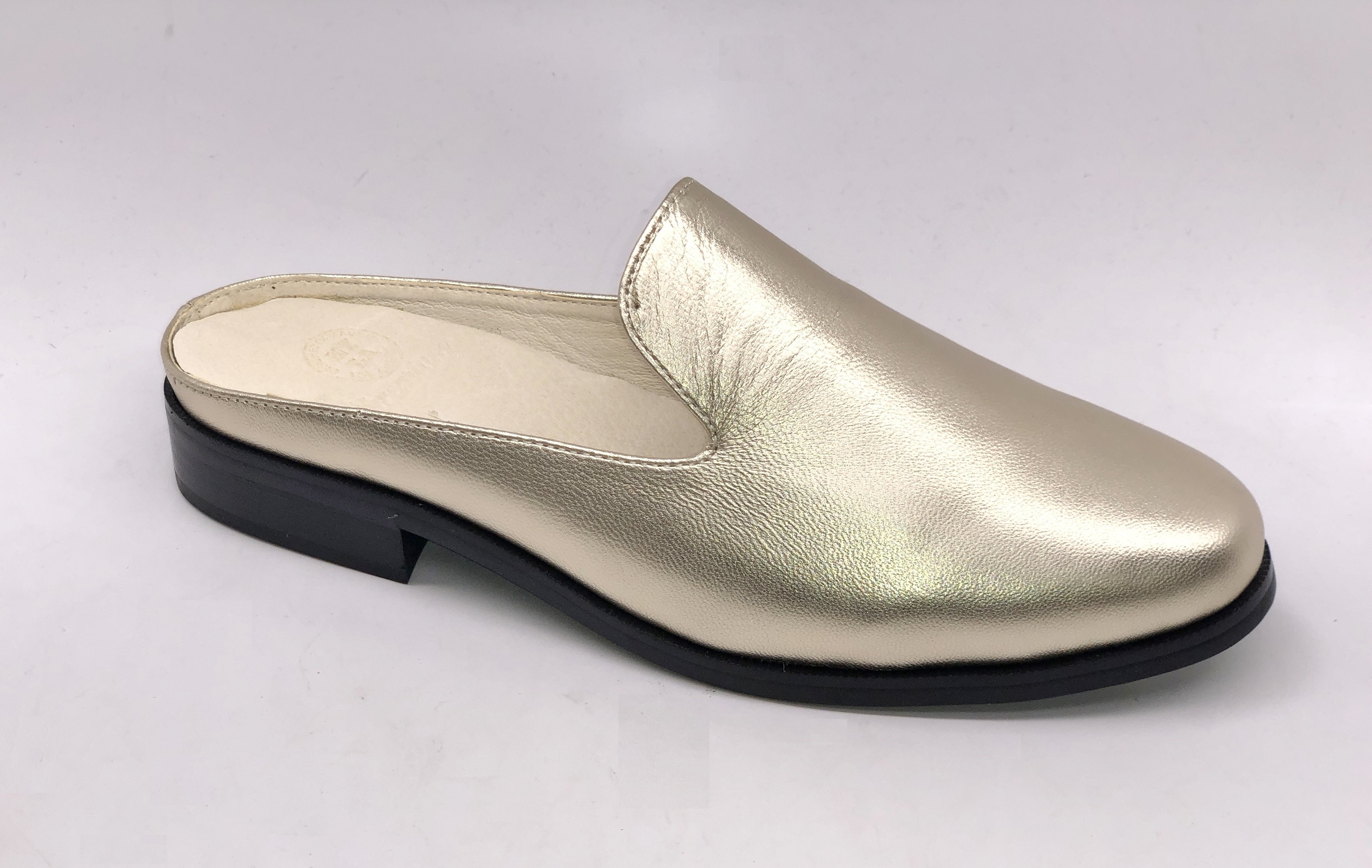 A pair of Long Beach shoes made from premium leather, featuring a sleek design with a full foam insole and slip-resistant outsole, perfect for comfort and style.