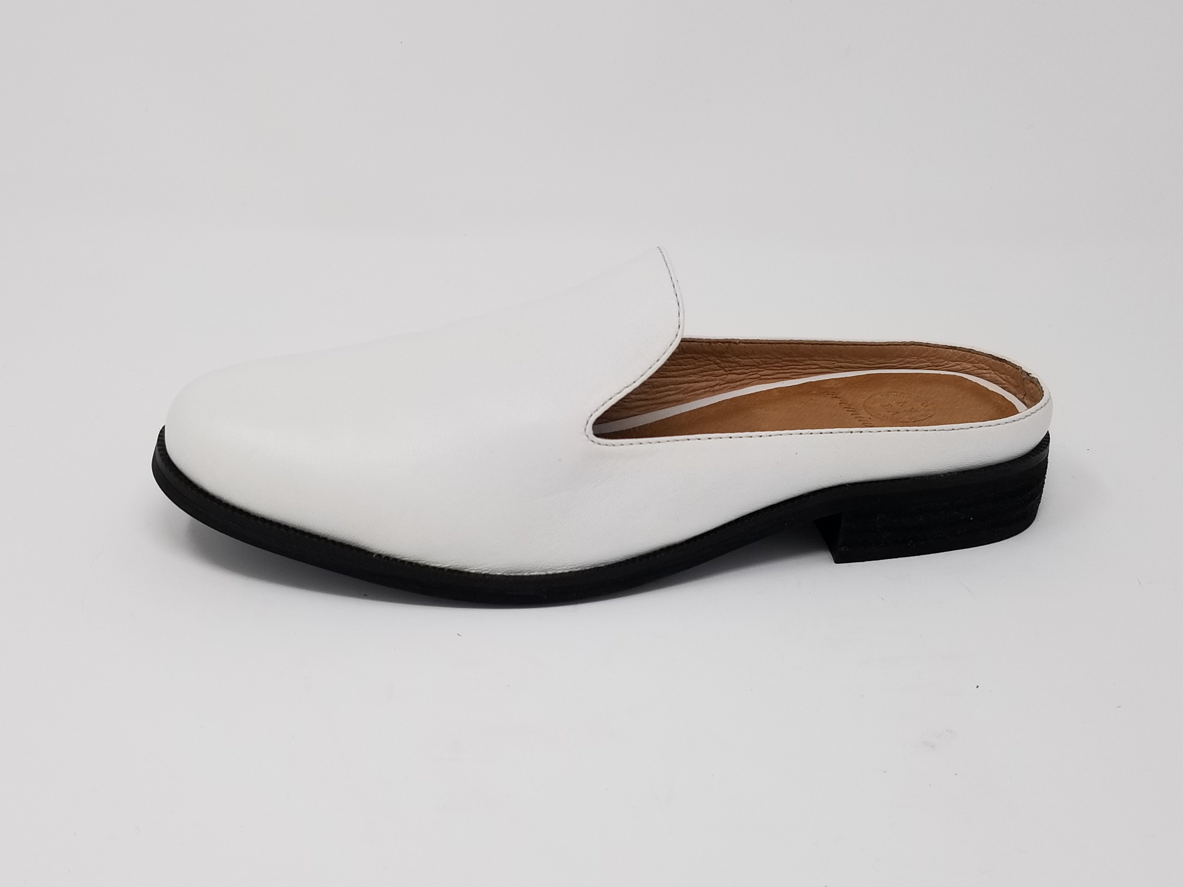 A pair of Long Beach shoes made from premium leather, featuring a sleek design with a full foam insole and slip-resistant outsole, perfect for comfort and style.