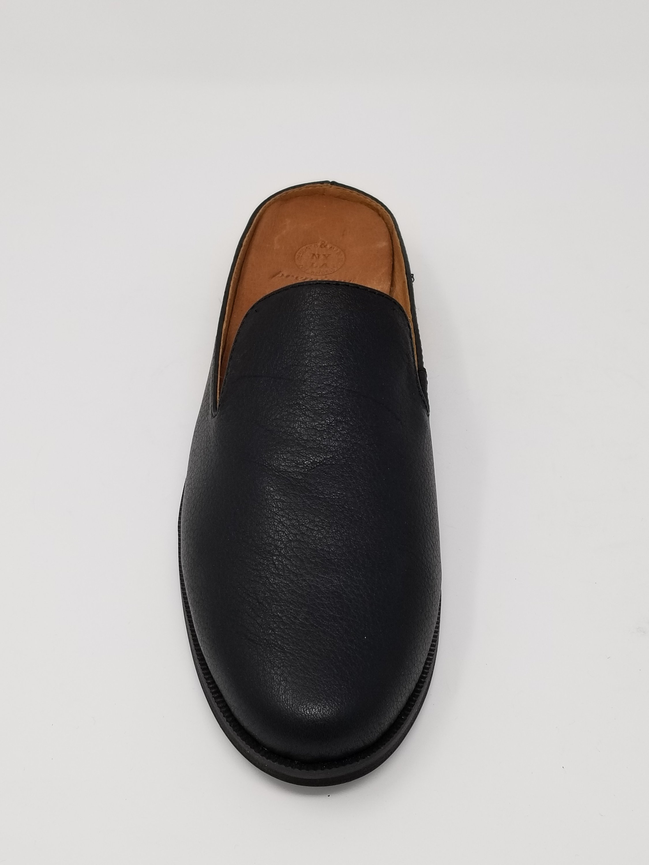 A pair of Long Beach shoes made from premium leather, featuring a sleek design with a full foam insole and slip-resistant outsole, perfect for comfort and style.