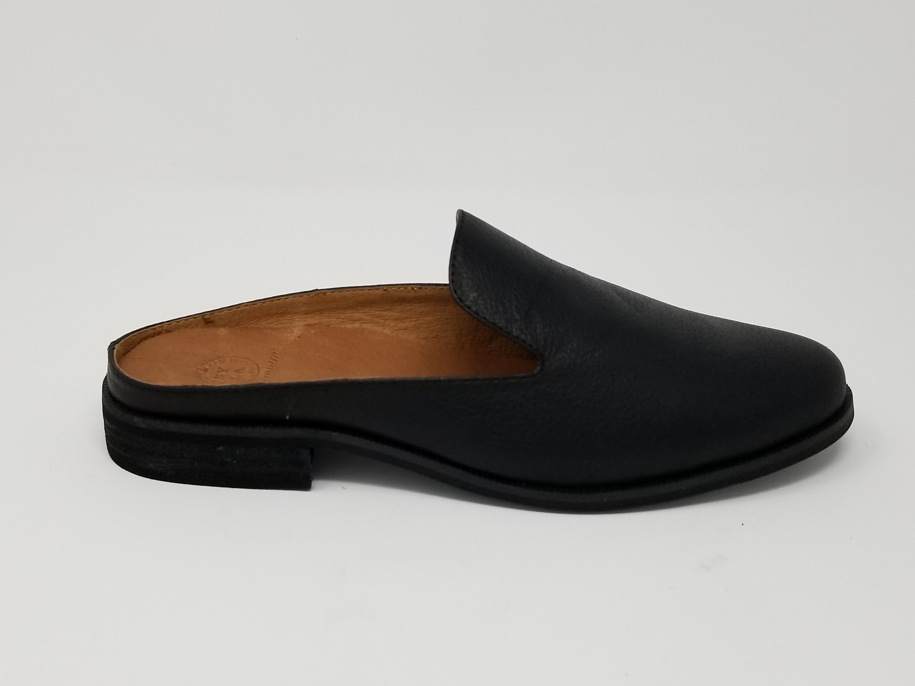 A pair of Long Beach shoes made from premium leather, featuring a sleek design with a full foam insole and slip-resistant outsole, perfect for comfort and style.