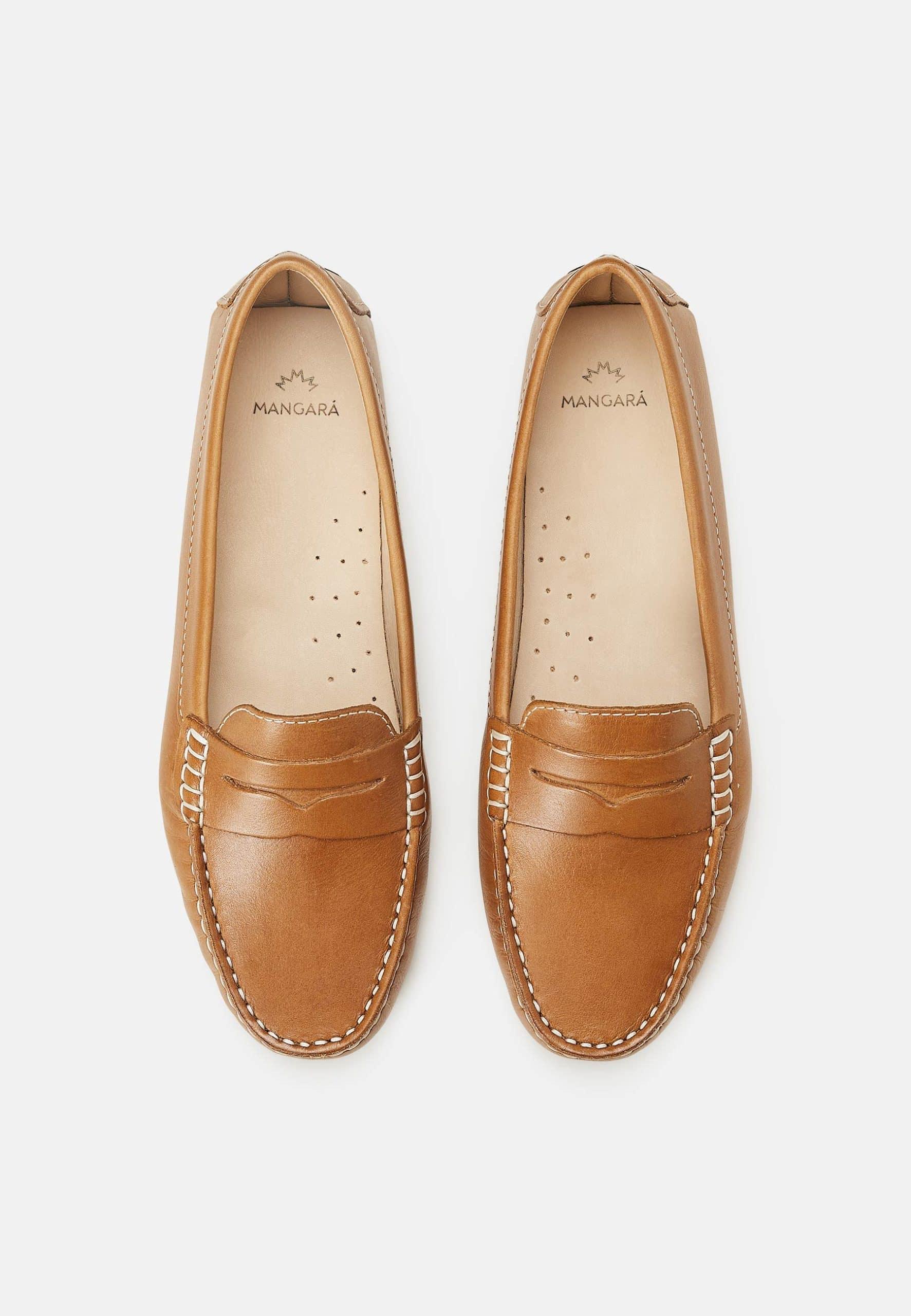 A pair of Mangará Angico Penny Loafers made from high-quality leather, showcasing their classic design and elegant finish.