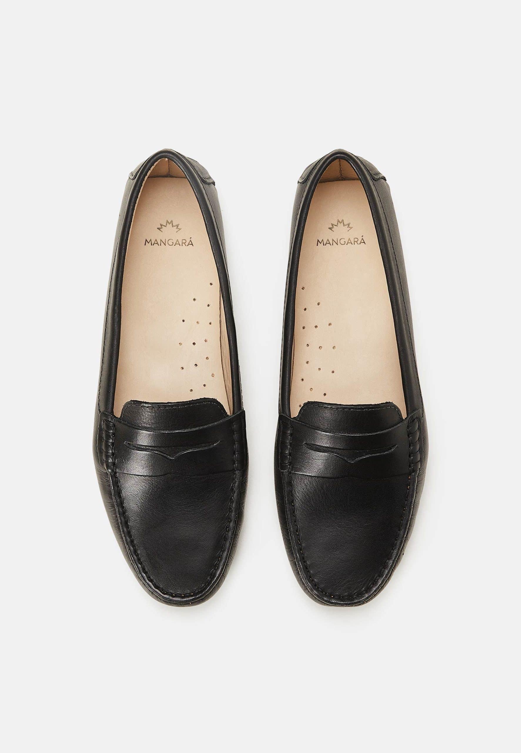 A pair of Mangará Angico Penny Loafers made from high-quality leather, showcasing their classic design and elegant finish.