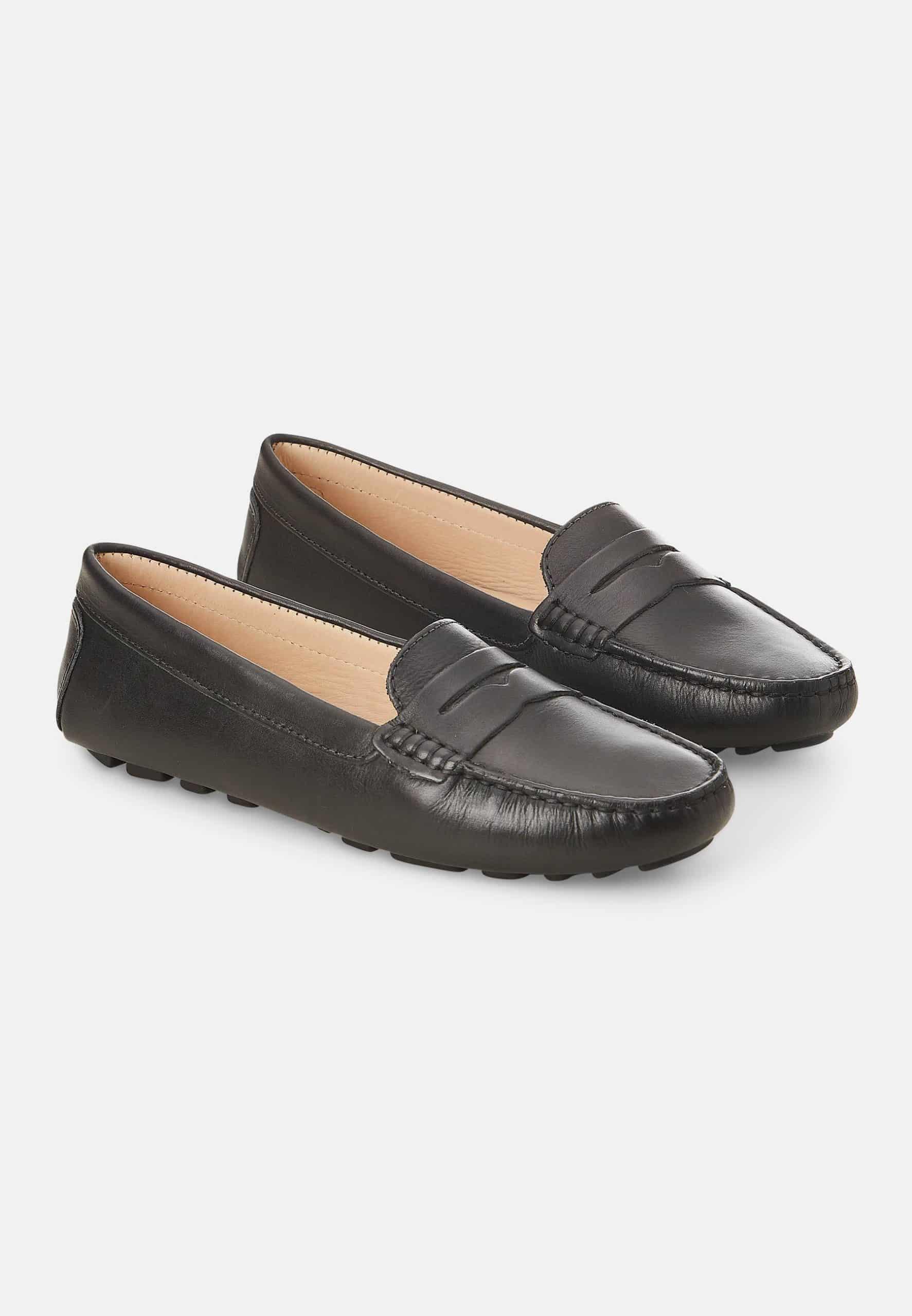 A pair of Mangará Angico Penny Loafers made from high-quality leather, showcasing their classic design and elegant finish.