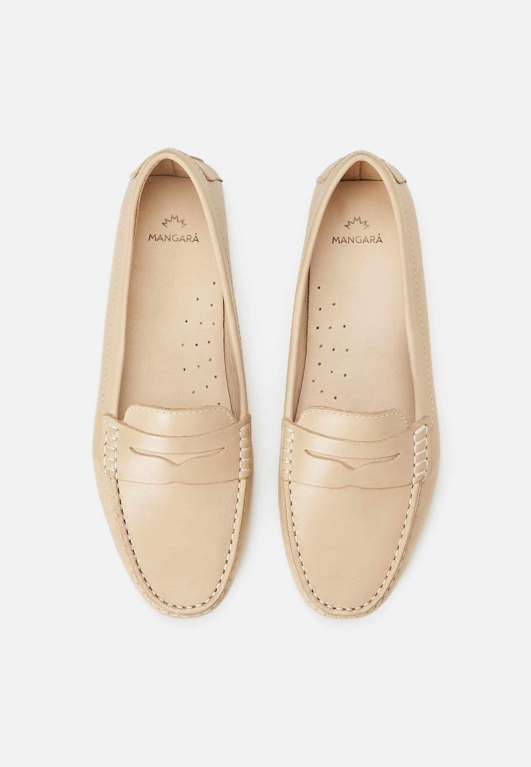 A pair of Mangará Angico Penny Loafers made from high-quality leather, showcasing their classic design and elegant finish.