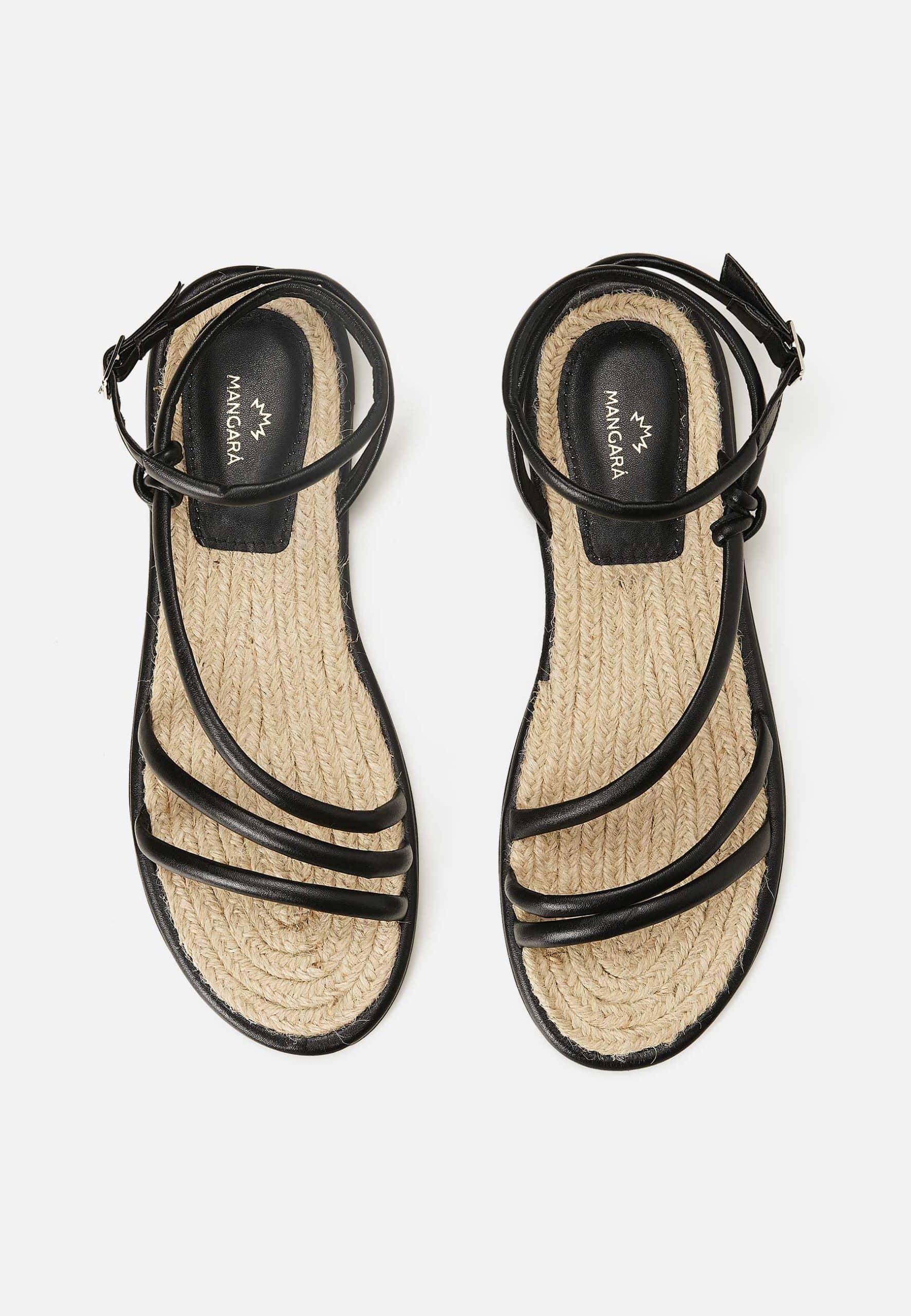 A pair of elegant Mangará Angico Women's Sandals made from high-quality leather, showcasing their stylish design and comfortable fit.