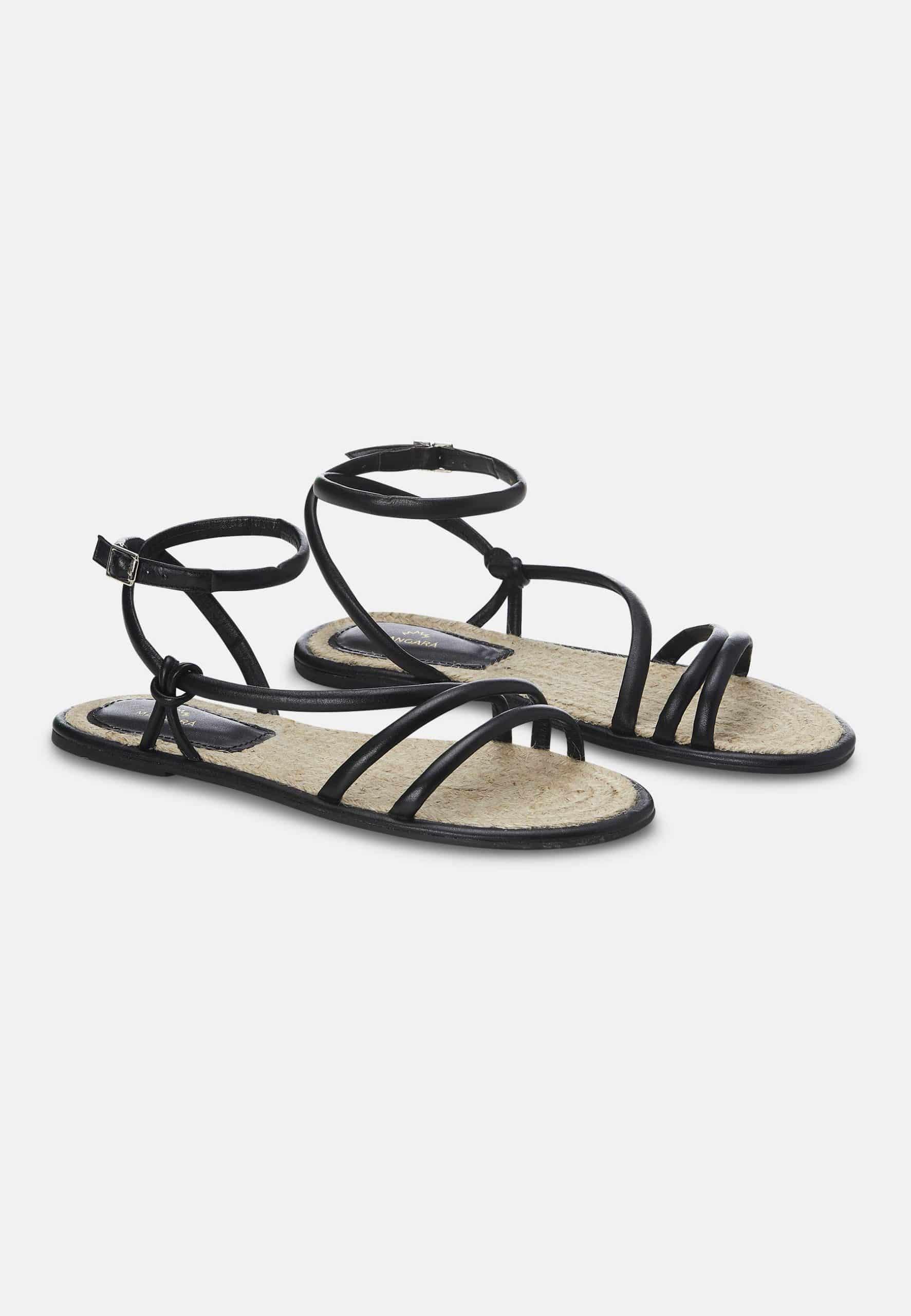 A pair of elegant Mangará Angico Women's Sandals made from high-quality leather, showcasing their stylish design and comfortable fit.