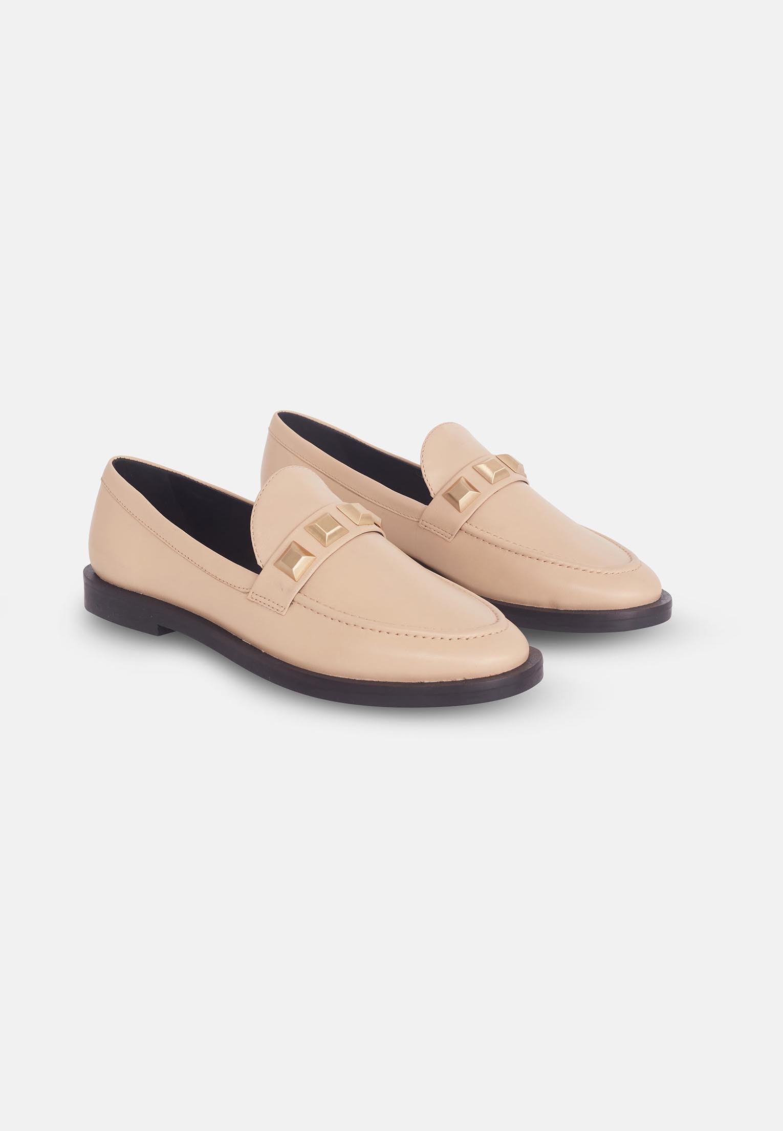 A pair of Mangará Women's Loafers Caete Leather showcasing premium goat leather, round toe design, and stylish metal studs.