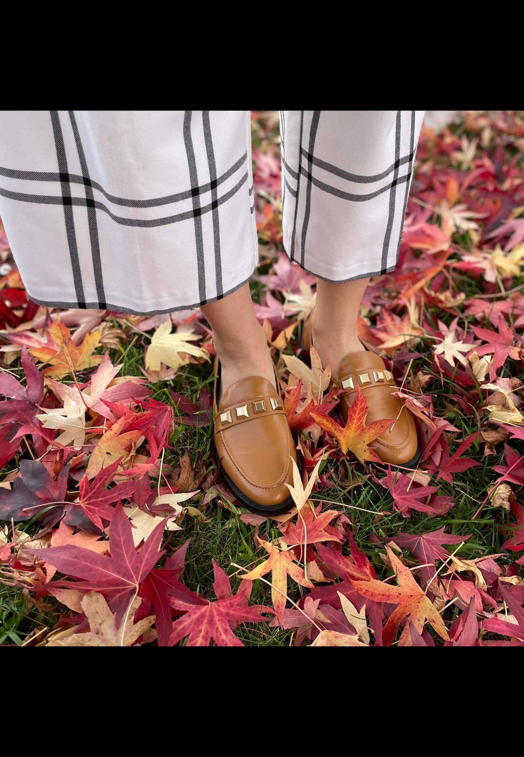 A pair of Mangará Women's Loafers Caete Leather showcasing premium goat leather, round toe design, and stylish metal studs.