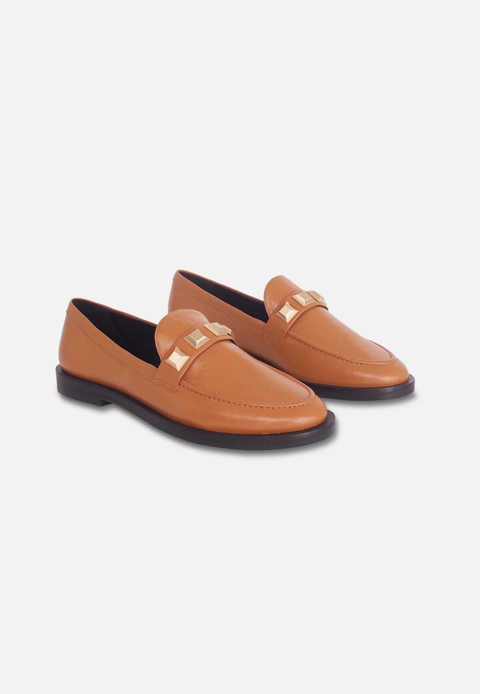 A pair of Mangará Women's Loafers Caete Leather showcasing premium goat leather, round toe design, and stylish metal studs.