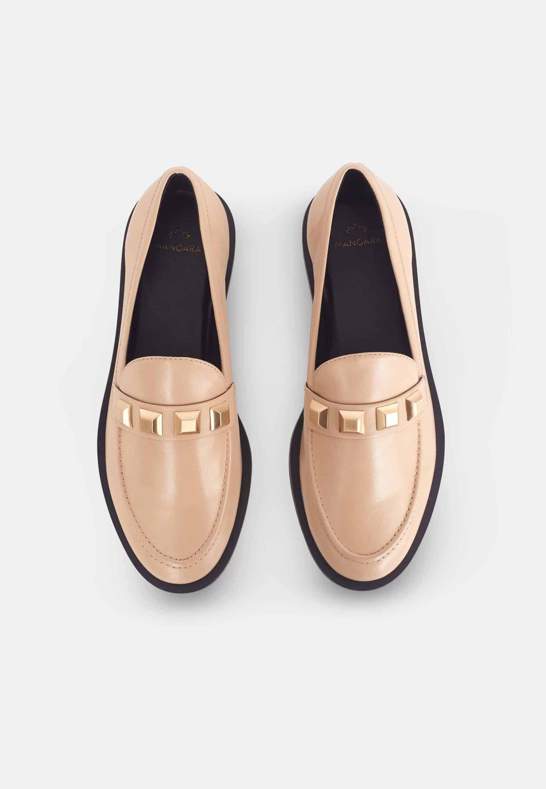 A pair of Mangará Women's Loafers Caete Leather showcasing premium goat leather, round toe design, and stylish metal studs.